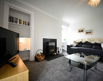 Tigh Beag Na Mara Living Room with Woodburning Stove and WIFI Internet Access