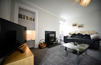 Tigh Beag Na Mara Living Room with Woodburning Stove and WIFI Internet Access