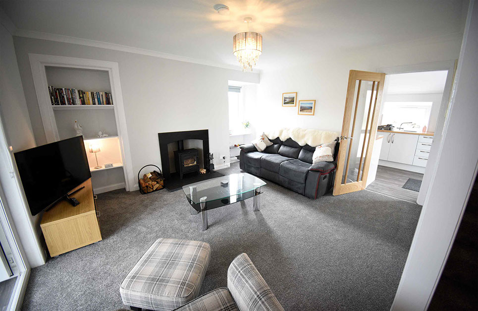 Tigh Beag Na Mara Self Catering Accommodation Living Room with Smart TV Woodburning Stove Sea Views and WIFI Internet access